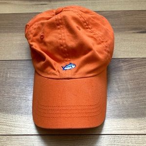Southern Tide orange ball cap.
